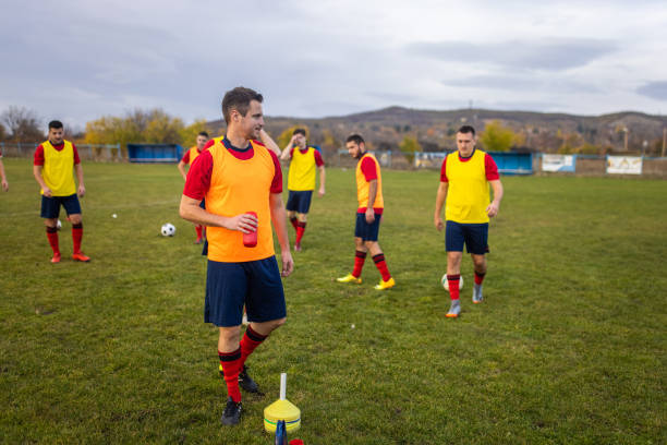 istock Male soccer players taking a break from soccer training 1371064802