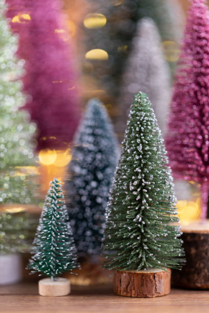 istock Colorful Christmas tree on wooden, bokeh background. 1371067222