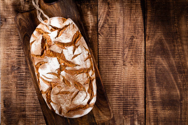 istock Sliced rye bread on cutting board, closeup.. 1371067246