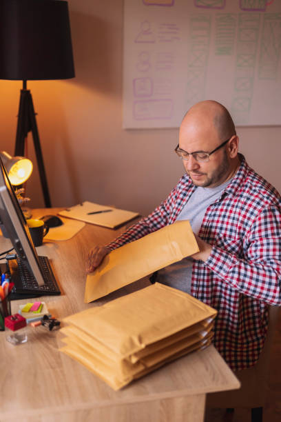 istock Small business owner packing products for delivery 1371067866