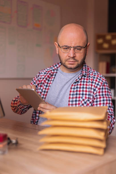 istock Small business owner getting online store orders ready for shipping 1371067881