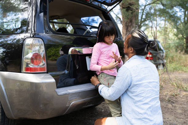 istock A dad holding his upset daughter when she get hurt in camping. 1371068013