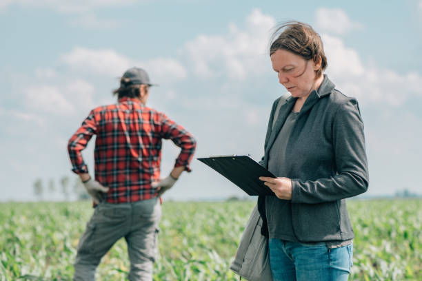 istock Mortgage loan officer assisting farmer in financial allowance application process 1371068921