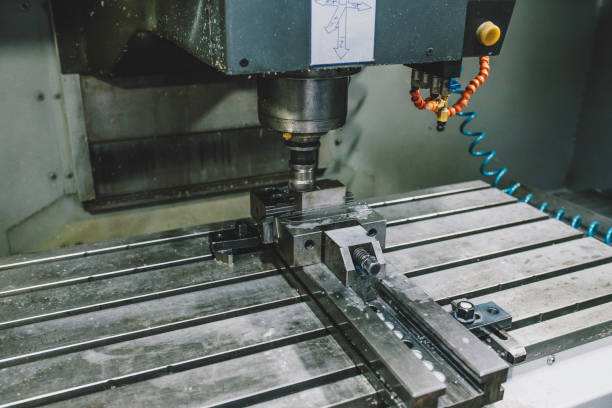istock Metalworking CNC milling machine at work. The mold and die manufacturing process. 1371068985