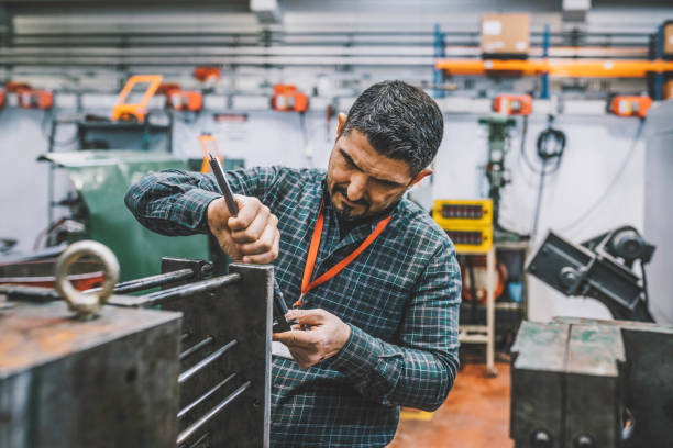 istock Lathe worker man working with a vernier and milling machine in a factory 1371069039