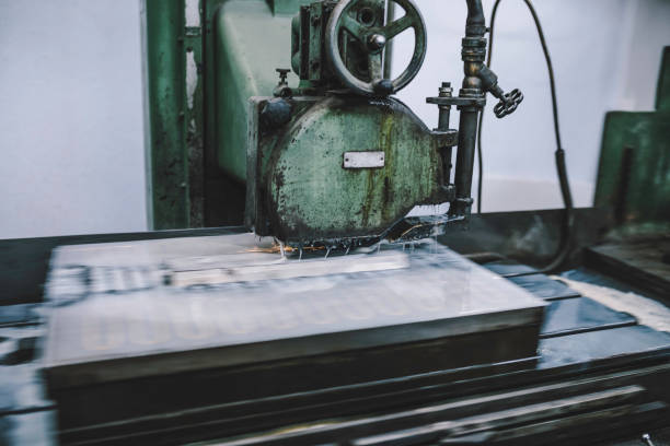 istock Metalworking CNC milling machine at work. The mold and die manufacturing process. 1371069132