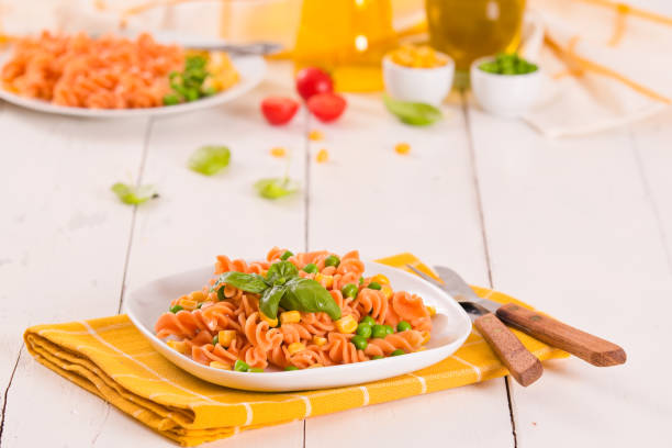istock Fusilli pasta with peas and sweet corn. 1371070899