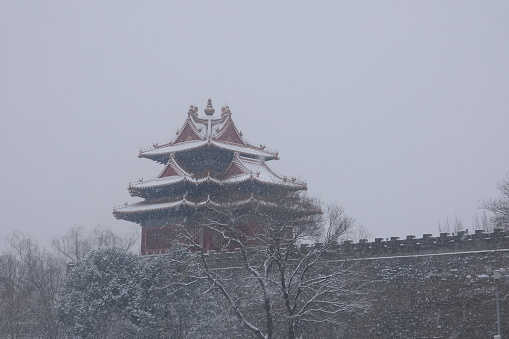 Corner Tower is covered with snow, Forbidden City, China, Beijing.