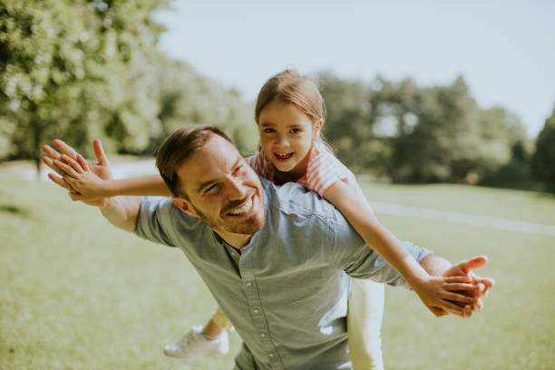 Father with daughter having fun at the park