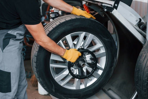 istock Work in progress. Man in uniform is in the auto service 1371073065