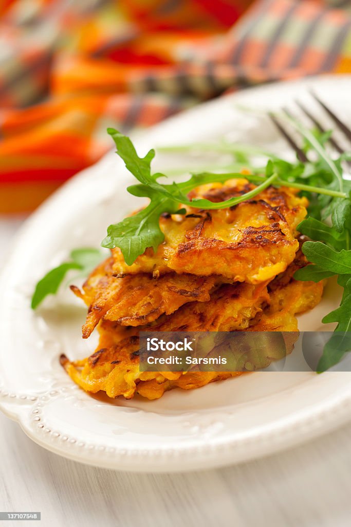 Carrot pancakes Carrot pancakes with rucola Pancake Stock Photo