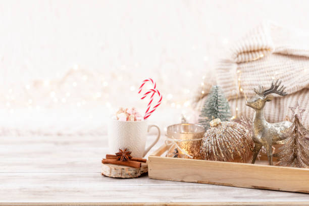 istock Cup with a hot drink, marshmallow on a table with christmas decorations. 1371075986