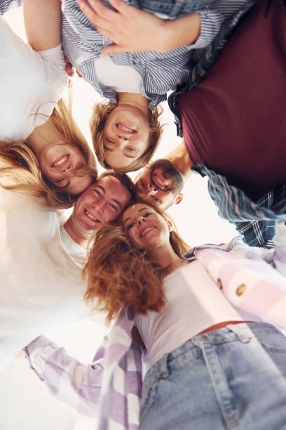 istock Looking down. Group of friends standing together 1371077705