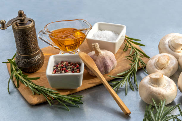 istock Ingredients for pork roasting: spices, herbs, agaricus, oil 1371077964
