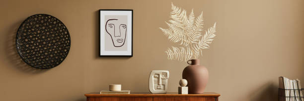 istock Stylish interior with design wooden commode, stool, dried flowers in vase, unique decoration, carpet, mock up poster frame and elegant personal accessories. Modern living room in classic house. 1371079074