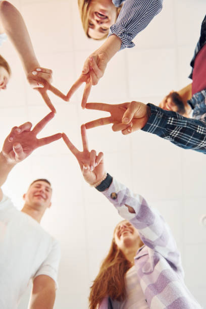 istock Making gesture by hands. Group of friends standing together 1371079440