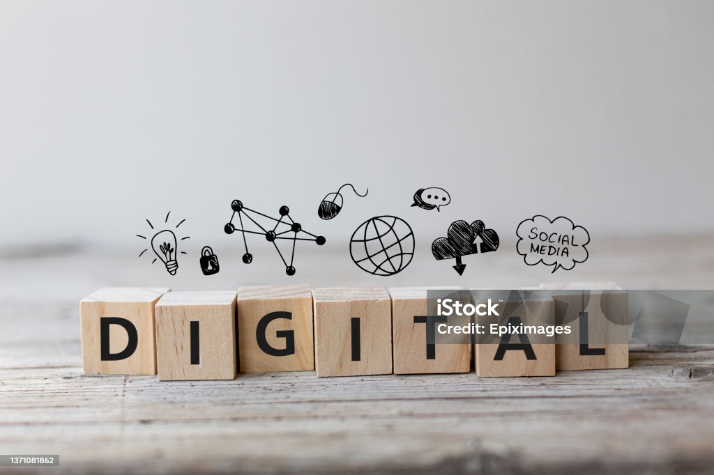Digital wording on wooden cubes with education icons Digital strategy Concept. Digital wording on wooden cubes with speech bubbles. Digitization Stock Photo