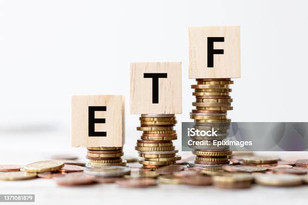 Concept Etf Exchange Traded Fund Wording On Wooden Cubes With Coins Stock Photo - Download Image Now