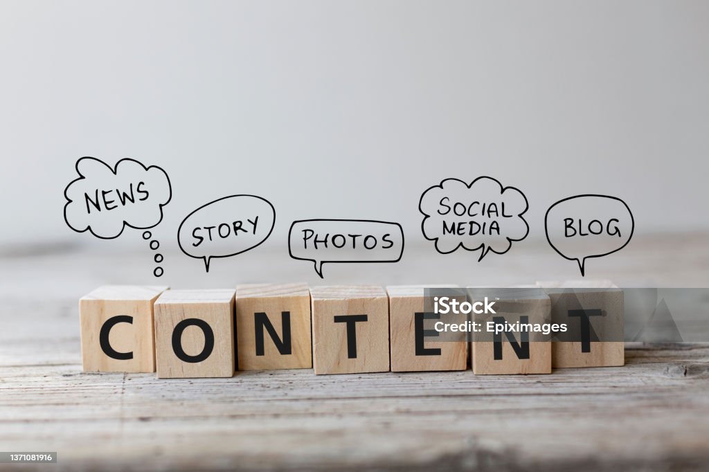 Content wording on wooden cubes with speech bubbles. Create Content strategy Concept. Content wording on wooden cubes with speech bubbles. Copywriter Stock Photo