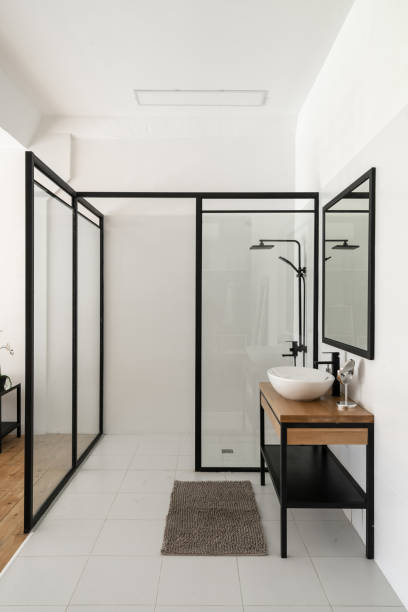 istock Modern bathroom interior design with glass partitions 1371081992