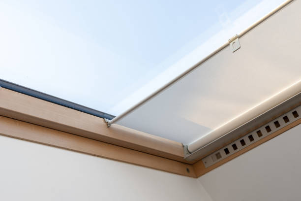 istock Attic or mansard window in wooden frame with roller blinds 1371082057