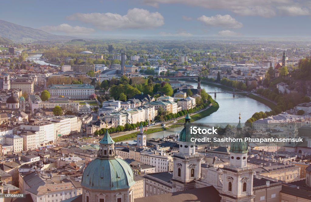 Panoramic view in a Spring season  scene at a historic city of Salzburg with Salzach river in beautiful golden evening light sky at sunset, Salzburger Land, Austria Vienna - Austria Stock Photo