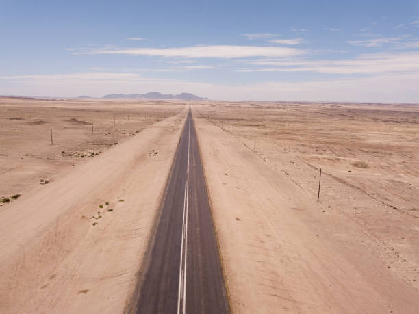 istock Open road in  a desert landscape 1371084587