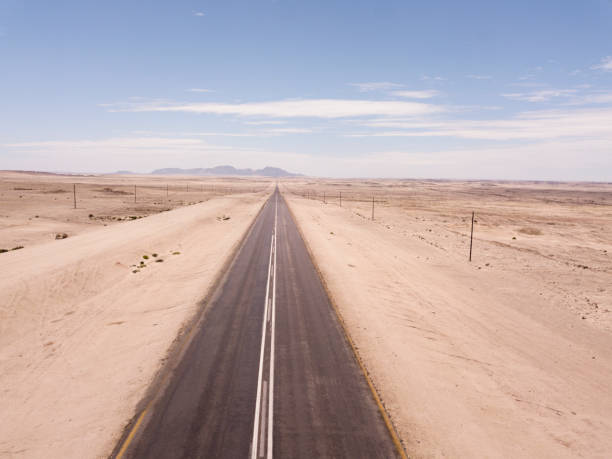 istock Open road in  a desert landscape 1371084608