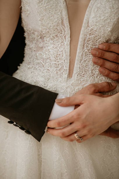 istock Bride and groom hugging, wedding ring 1371089450