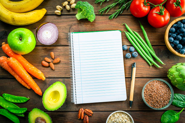istock Healthy vegan food frame and blank note pad 1371090564