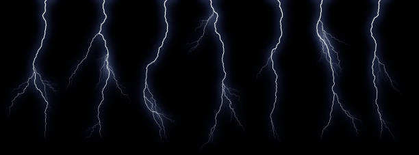istock Set of different lightning bolts isolated on black background 1371094649