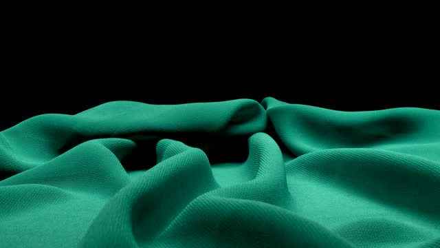MACRO CAMERA MOVEMENT ON A GREEN CANVAS WITH A BLACK BACKGROUND