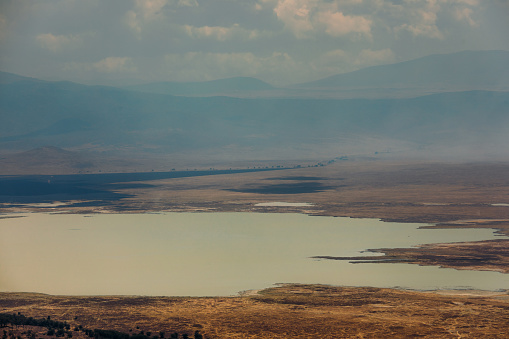 View of the crater caldera with huge lake and savannah plain in East Africa