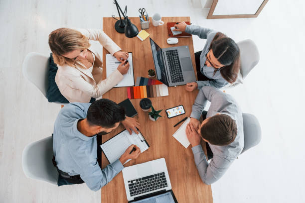 istock Talking about project. Group of business people that working in the office 1371098888