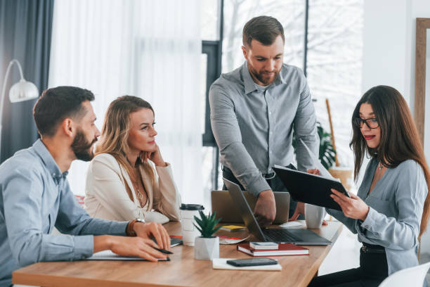 istock Modern office. Group of business people that working on the project 1371098961