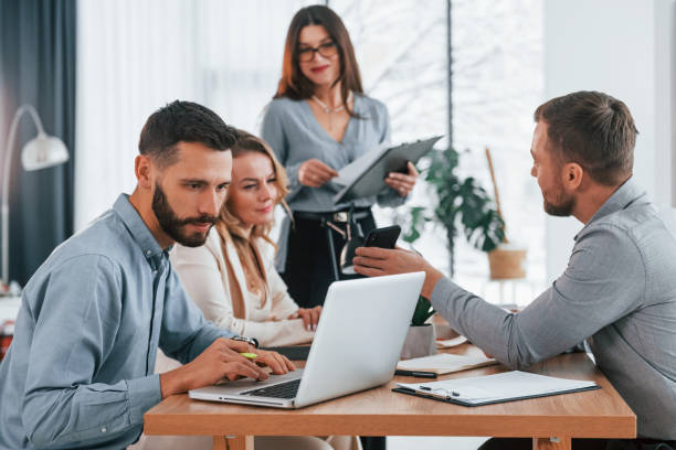 istock Modern technologies. Group of business people that working on the project in the office 1371099084