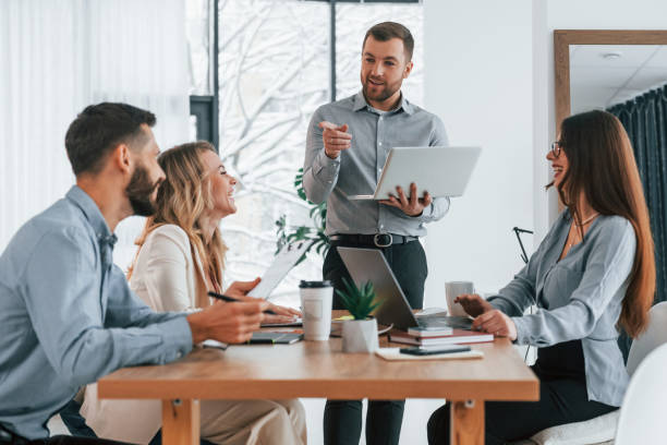 istock Using brainstorming technique. Group of business people that working on the project in the office 1371099800