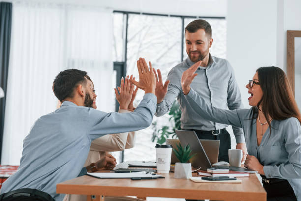 istock Using brainstorming technique. Group of business people that working on the project in the office 1371099814