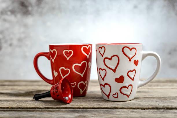 istock Two mugs for coffee on wooden background 1371099820