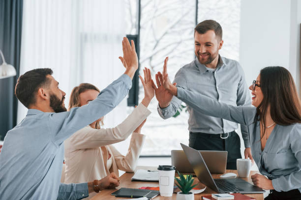 istock Using brainstorming technique. Group of business people that working on the project in the office 1371099833