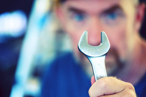 istock Handyman with a wrench 1371100283