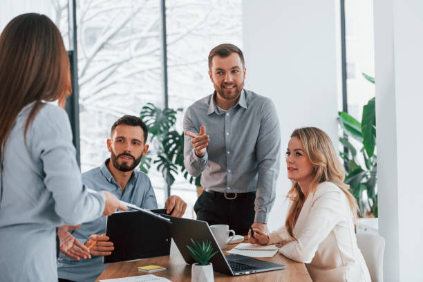 istock Sharing some ideas. Group of business people that working on the project in the office 1371100523