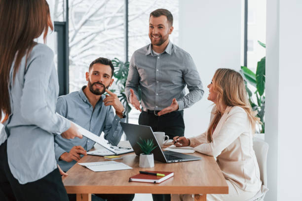 istock Sharing some ideas. Group of business people that working on the project in the office 1371100528