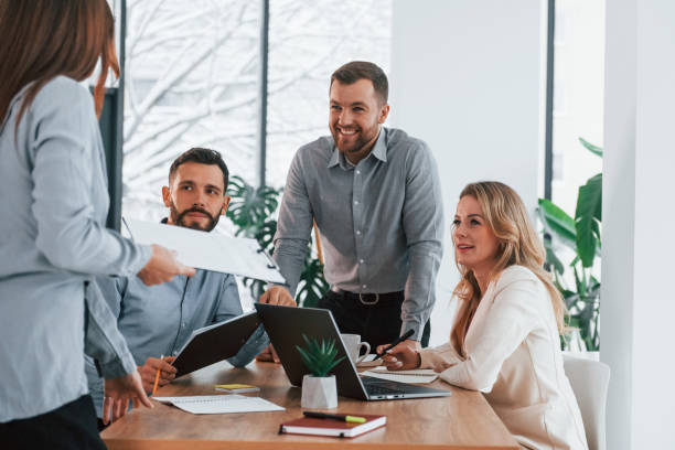 istock Sharing some ideas. Group of business people that working on the project in the office 1371100537