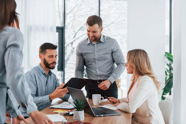 istock Sharing some ideas. Group of business people that working on the project in the office 1371100545