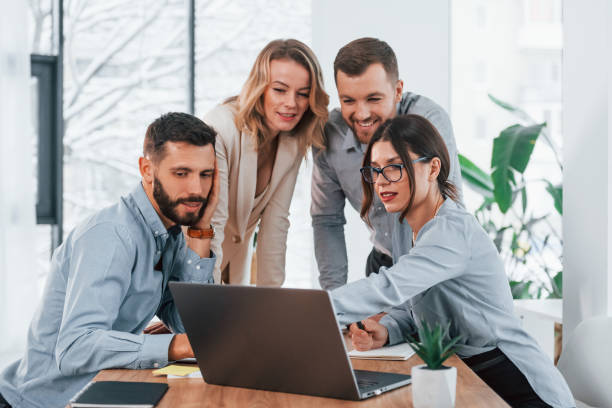 istock Internet connection by using laptop. Group of business people that working on the project in the office 1371101310