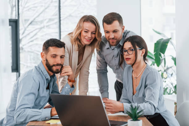 istock Internet connection by using laptop. Group of business people that working on the project in the office 1371101312