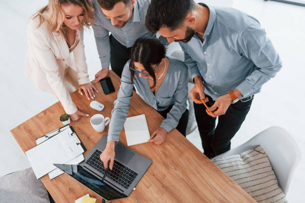 istock Top view of business people that working by using laptop 1371101407