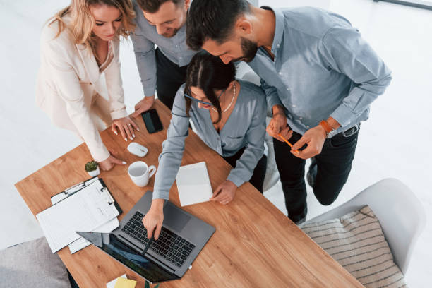 istock Top view of business people that working by using laptop 1371101409