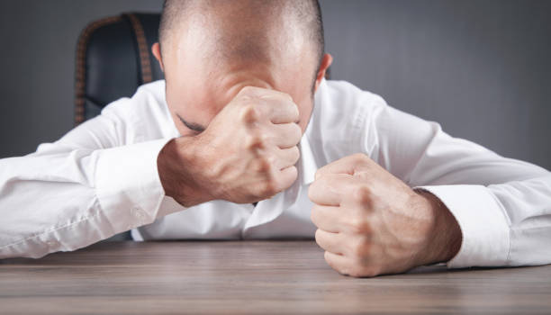 istock Angry businessman showing his fists. 1371107448